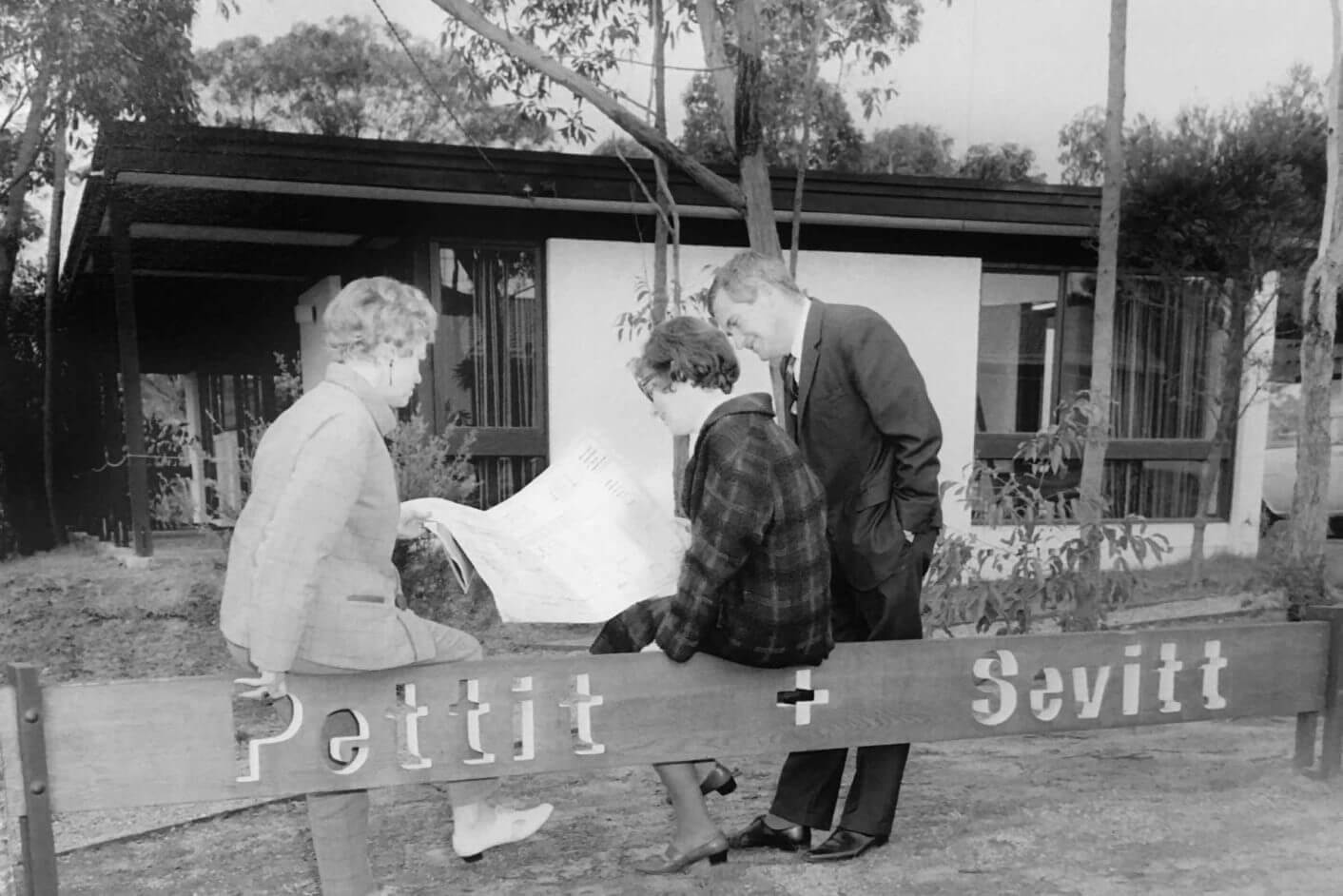 Pettit+Sevitt_Sitting-on-Sign_Sml